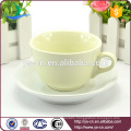 yellow porcelain ceramic cup and saucer